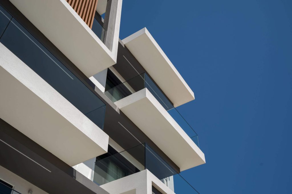 Detail of the cantilevers and glass balustrades on the building's front.