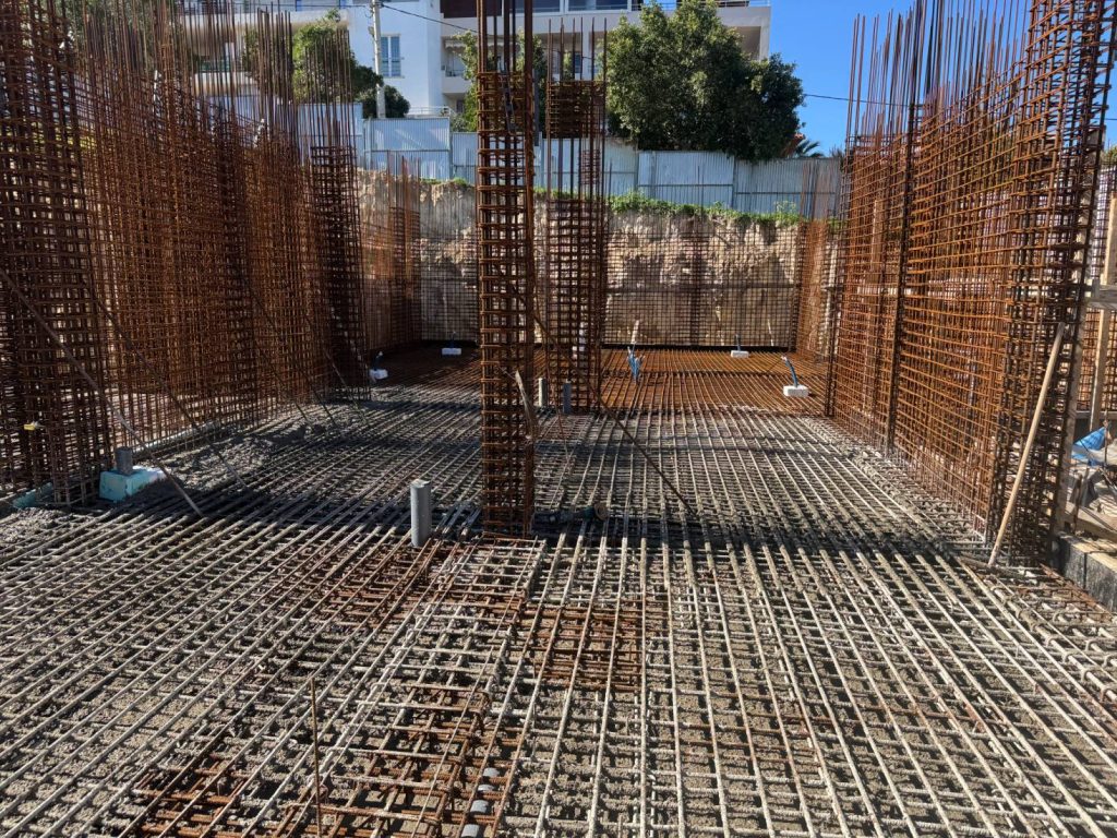 The reinforcement for the raft foundation and the basement walls.