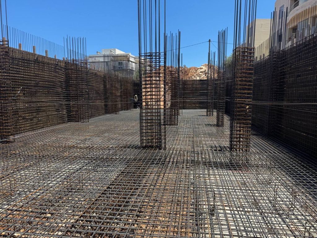 The foundation and wall reinforcement for another building in the complex.