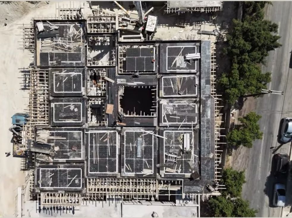 Aerial photo of the slab formwork from above, with the opening for the stairwell.