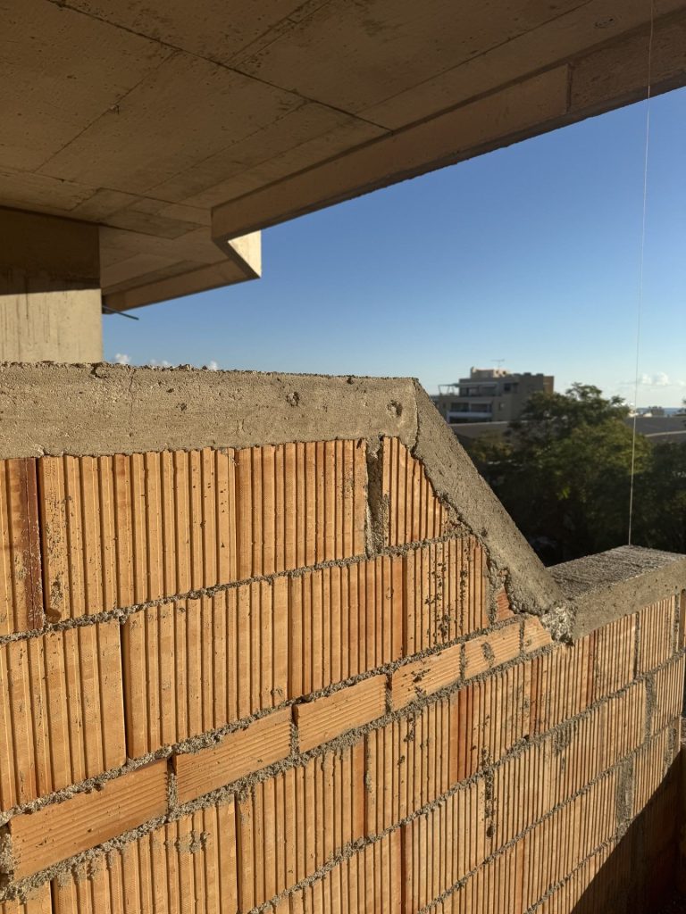 Clay brick walls on an upper floor.