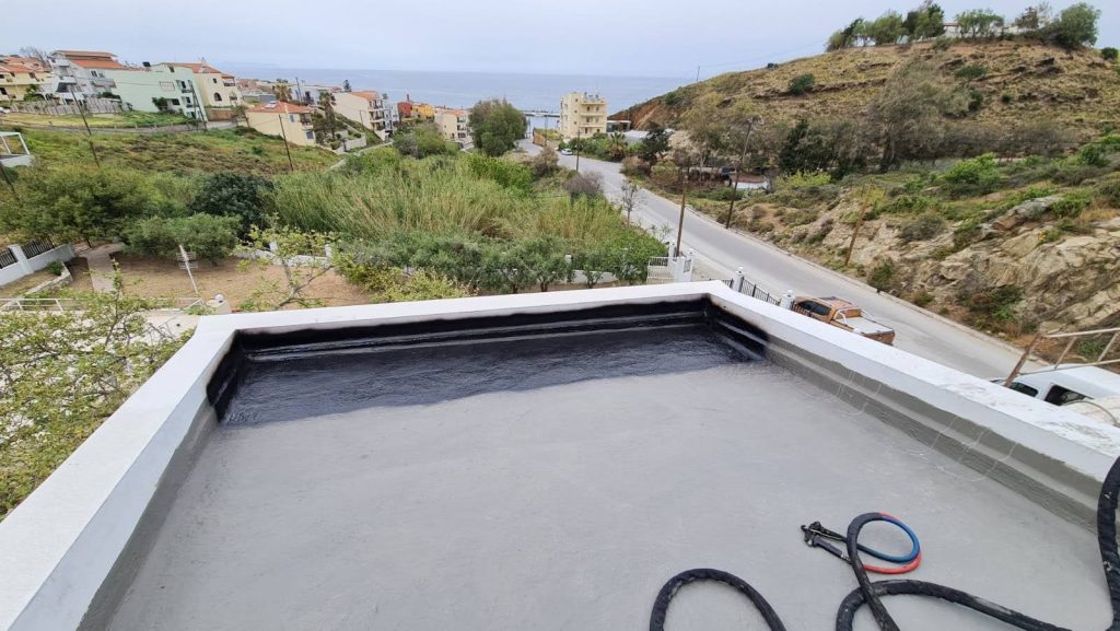 The roof terrace after waterproofing, with Panormo and the sea in the background.