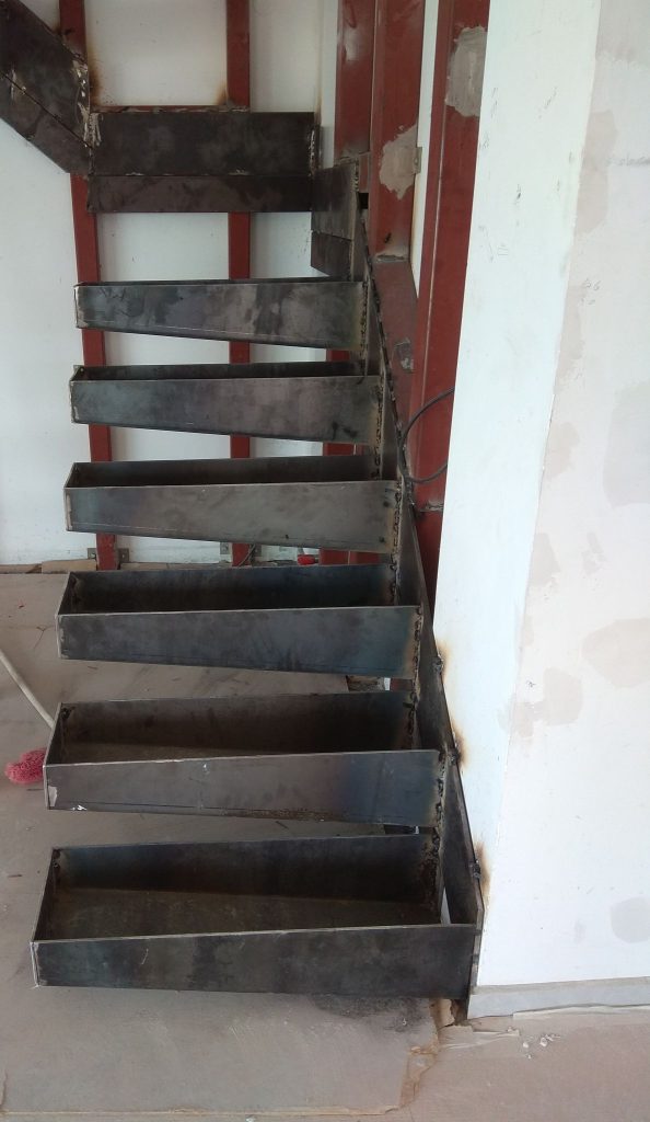 The steel frame of an interior staircase, before the treads were clad.