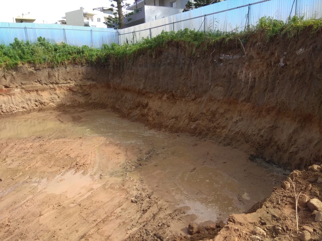 The basement pit after excavation, with the slopes around it.