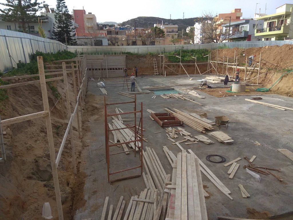 The concrete blinding layer at the bottom of the pit, with timber for the formwork.
