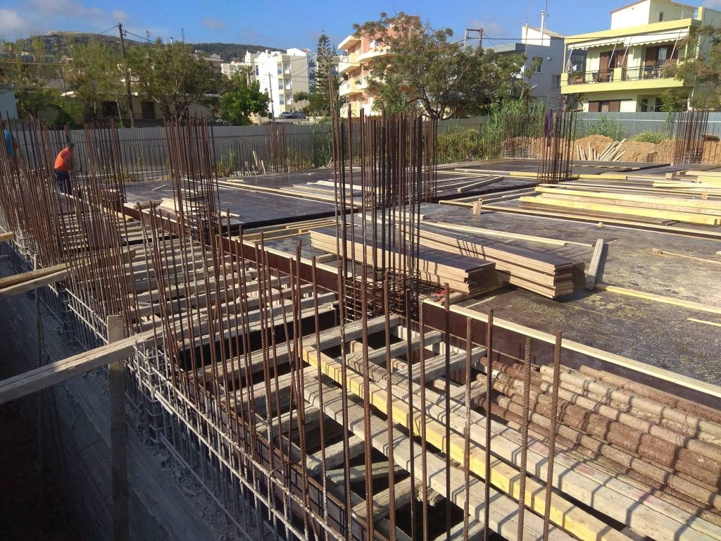 The formwork for the basement slab, with the column reinforcement sticking up through it.