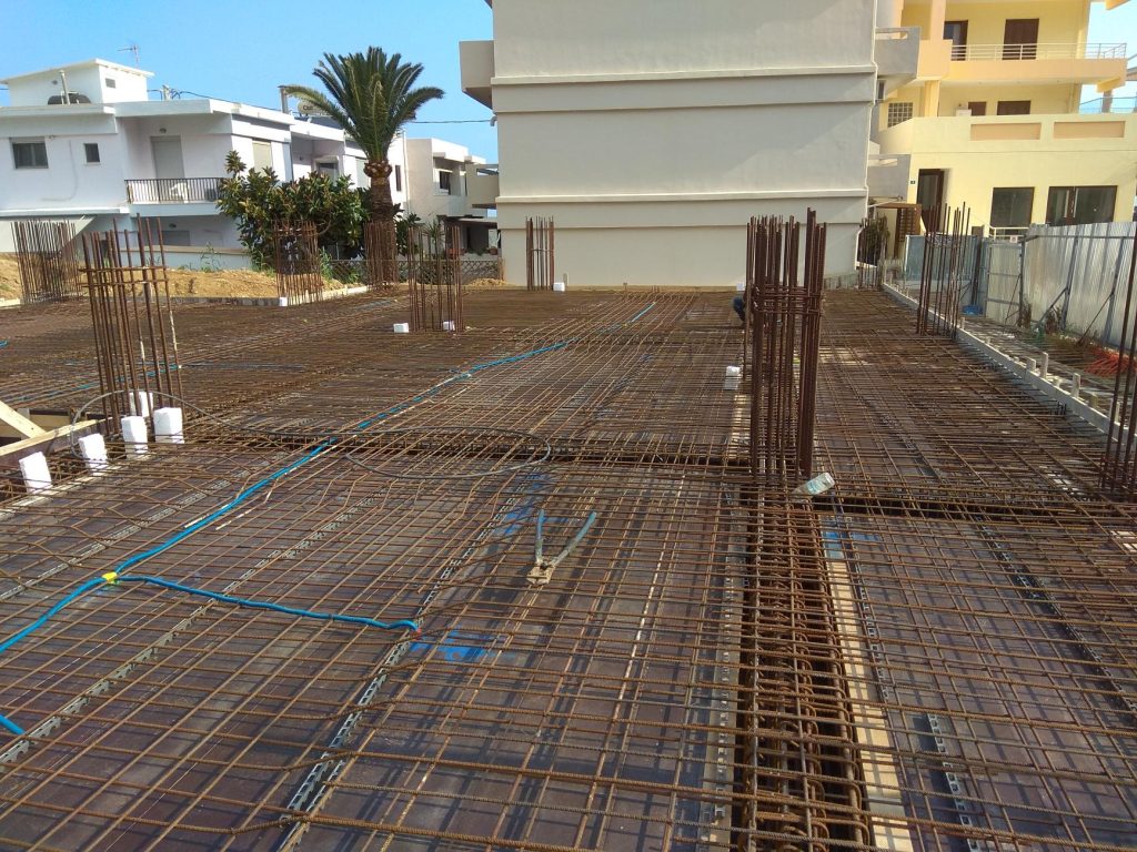 The slab reinforcement with the electrical conduits, before the concrete pour.