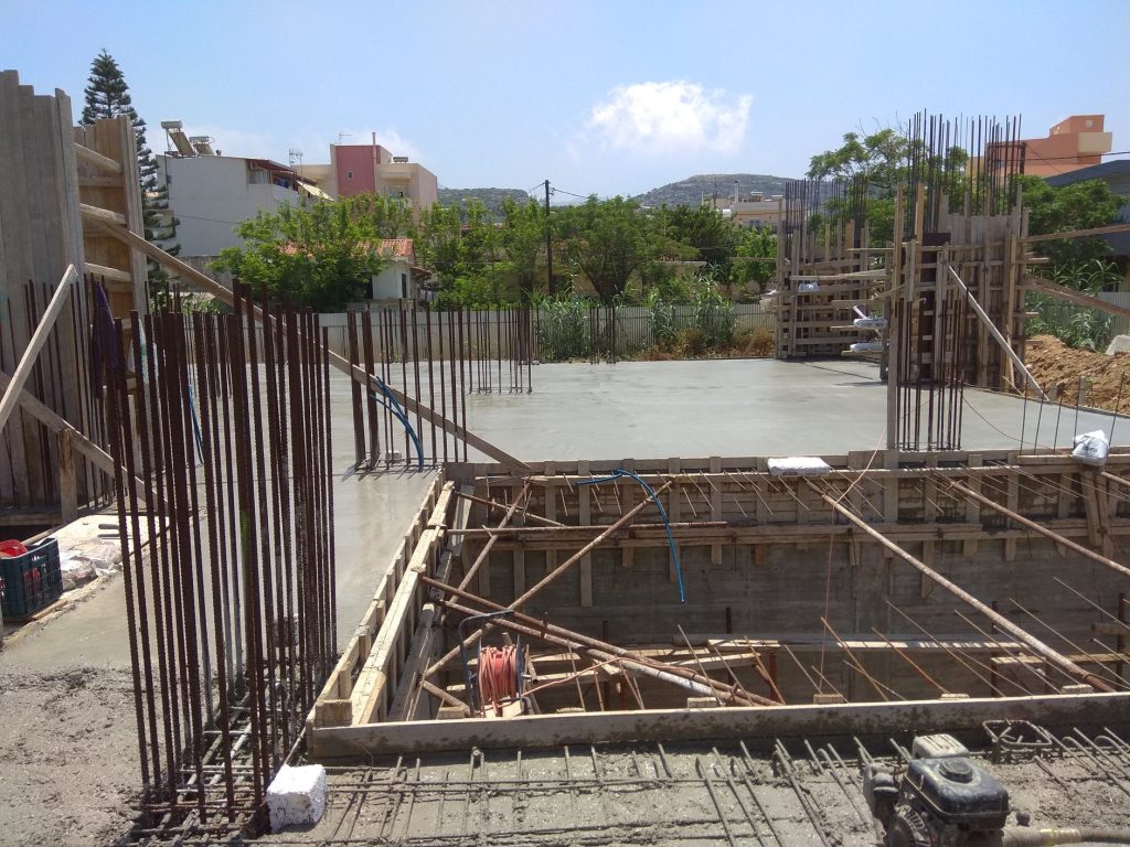 The slab after the concrete pour, with the starter bars for the next floor's columns.