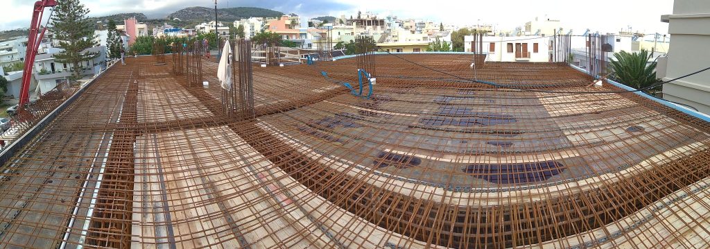 A panoramic view of the floor slab reinforcement, with the town in the background.