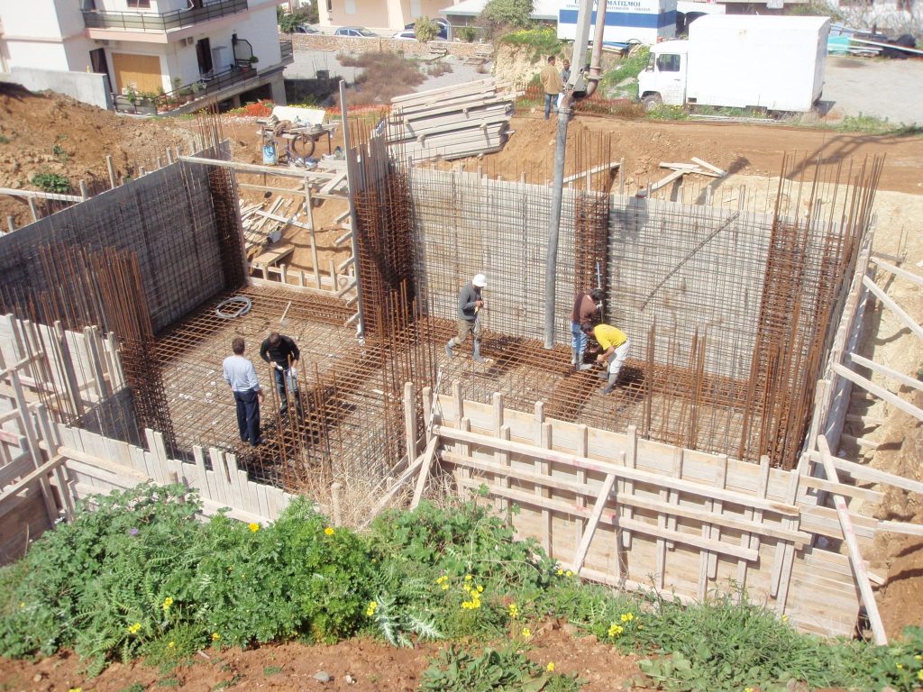 A crew tying the reinforcement for the basement walls.
