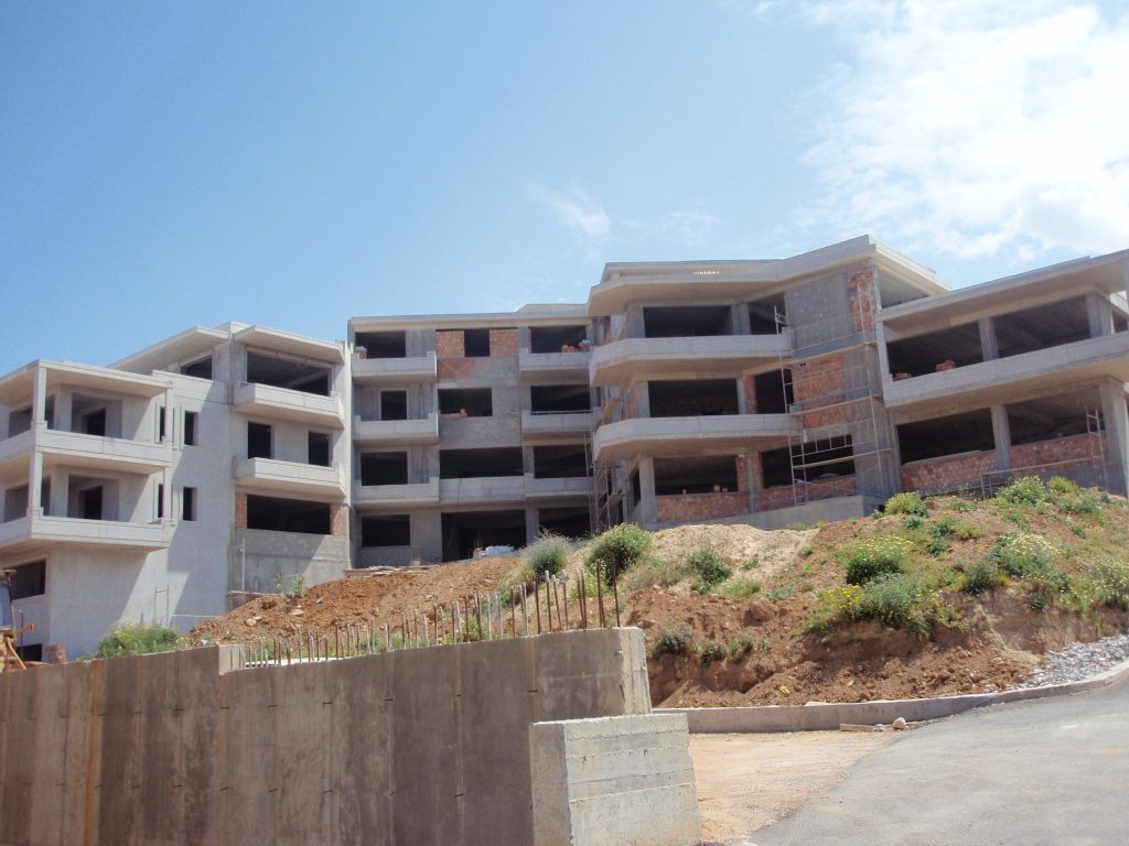 The complex from the lower part of the plot, with the retaining wall in the foreground.