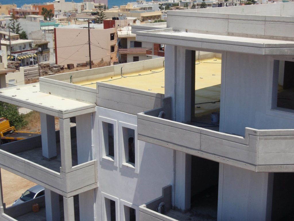 The roof terrace insulation and the upper-floor balconies, with the town in the background.