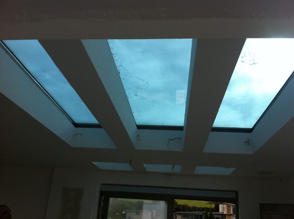 Skylights in an interior ceiling, bringing in natural light from above.