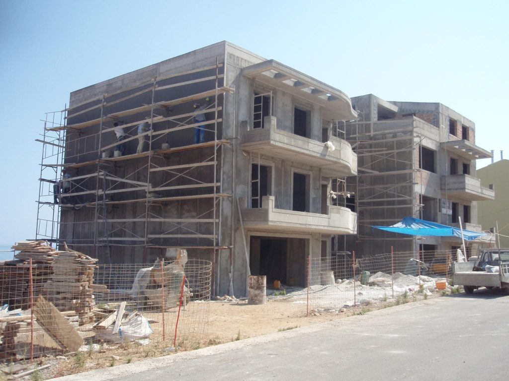 A crew on the scaffolding during work on the building's façades.