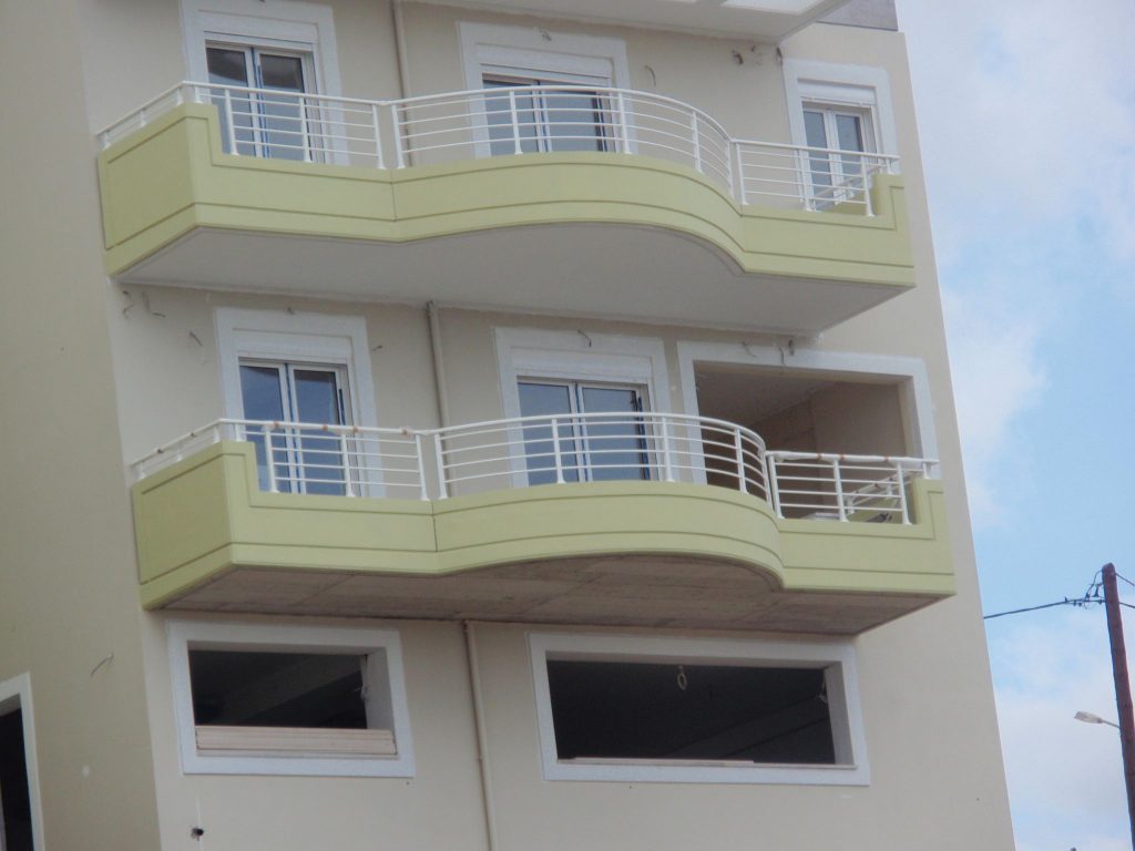 Detail of the curved balconies with their metal railings.