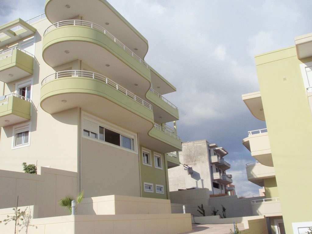 The curved balconies on the side facing the inner space of the complex.