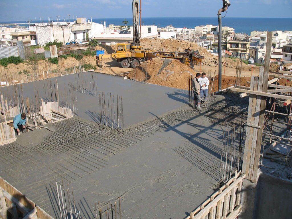 The freshly poured slab, with the town of Rethymno and the sea in the background.