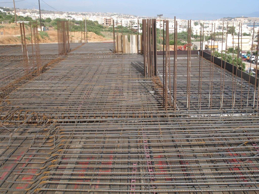 The floor slab reinforcement with the column starter bars and a view over the town.