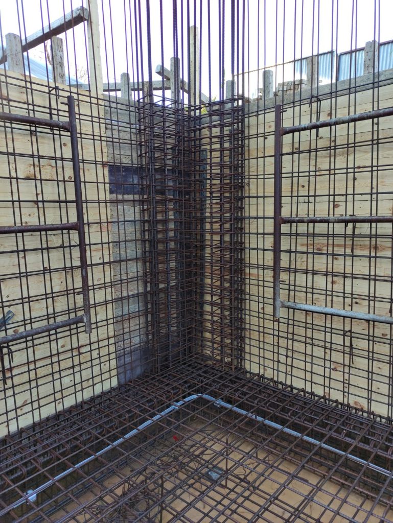 The reinforcement at the corner of the basement walls.