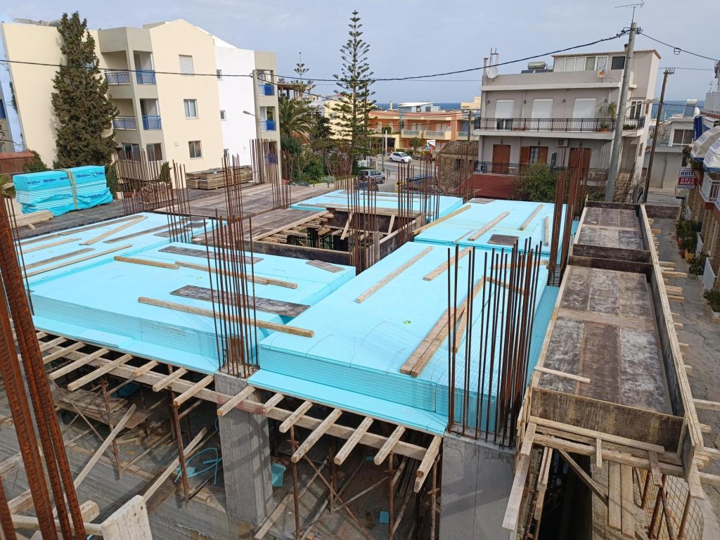 Thermal insulation boards on the slab formwork, before the reinforcement.