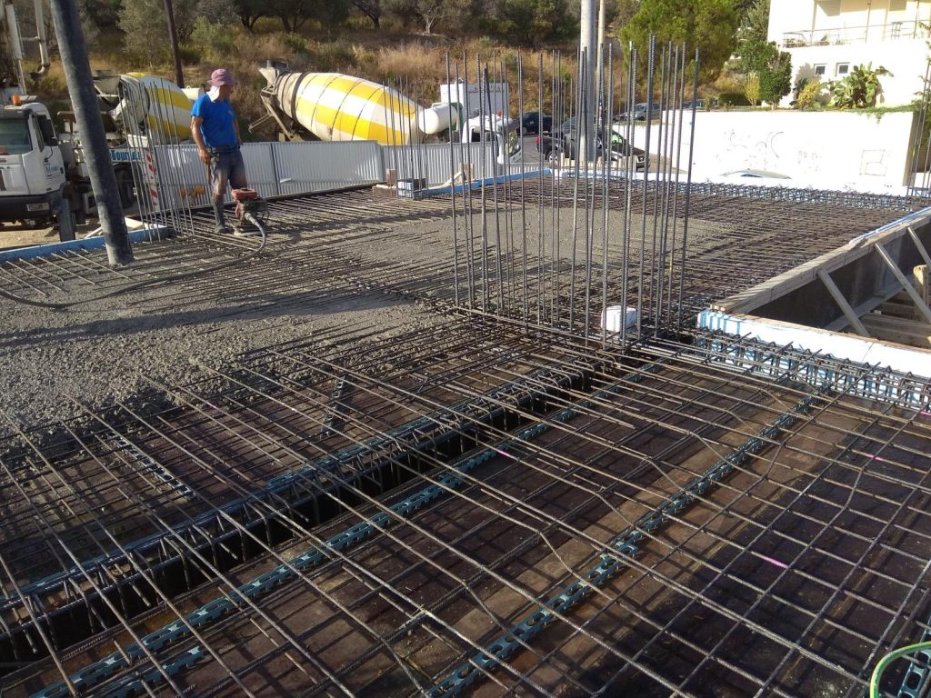 Pouring a slab, with the concrete mixer trucks in the street.