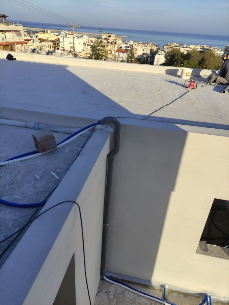 The roof terrace with its parapets, looking out over the town and the sea.